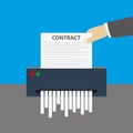 Hand inserts the contract document into the paper shredder Royalty Free Stock Photo