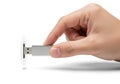 Hand inserting a silver USB flash drive into a port, data transfer concept {Ai generated Royalty Free Stock Photo