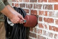 Hand installs faucet cover to protect it from freezing Royalty Free Stock Photo