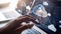 Hand interacting with cloud computing interface on laptop Royalty Free Stock Photo