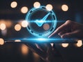 Hand interacting with digital checkmark on tablet screen glowing blue Royalty Free Stock Photo