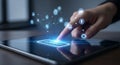 A hand interacting with a digital tablet displaying a connect button and various icons Royalty Free Stock Photo