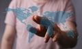 Hand interacting with a digital world map. Concept of global connection, technology, and networking Royalty Free Stock Photo