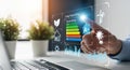 Hand interacting with futuristic digital interface showing energy efficiency chart data and icons Royalty Free Stock Photo