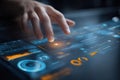 Hand interacting with a futuristic digital touchscreen interface displaying data and charts Royalty Free Stock Photo