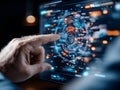 Hand interacting with futuristic holographic interface featuring advanced data and circular analytics visualization Royalty Free Stock Photo