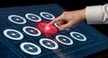 A hand interacting with a futuristic touchscreen interface displaying circular icons. Royalty Free Stock Photo