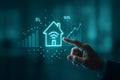Hand interacting with smart home investment data on screen Royalty Free Stock Photo