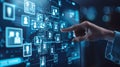 A hand interacts with a digital screen displaying a network of interconnected icons, representing data and connections Royalty Free Stock Photo