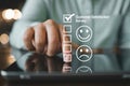 Customer Satisfaction Survey A Hand Interacting with a Digital Tablet to Provide Feedback and Ratings Royalty Free Stock Photo