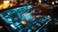 A hand interacts with a high-tech touchscreen display featuring vibrant graphics and futuristic controls in a modern setting Royalty Free Stock Photo