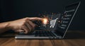 A hand interacts with a laptop, pointing towards floating shopping cartt