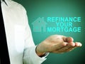 Hand with iscription refinance your mortgage