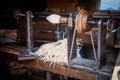 Hand jack plane and wood chips. Wood chip machine