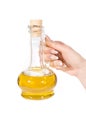 Hand and jug of oil Royalty Free Stock Photo