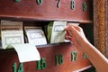 Hand keep fortune paper on shelf