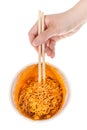 hand keeps chopsticks in prepared instant noodles Royalty Free Stock Photo