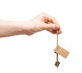 Hand and key with blank label Royalty Free Stock Photo