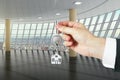 Hand with key from a new big loft Royalty Free Stock Photo