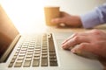 The hand on the keyboard and coffee Royalty Free Stock Photo