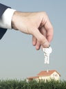 Hand with keys and a little house Royalty Free Stock Photo