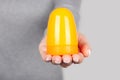 Hand with kids slime toy on grey background