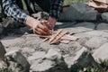 Hand kindles fire between folded chips