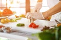 Hand with knife cutting egg. Royalty Free Stock Photo