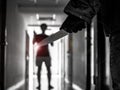 Hand with knife following young terrified in the apartment. man Bandit is holding a knife in hand, Threat Concept, Murder concept