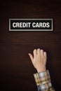 Hand is knocking on Credit Cards door Royalty Free Stock Photo