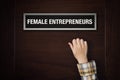 Hand is knocking on Female Entrepreneurs door