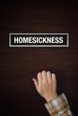 Hand is knocking on Homesickness door Royalty Free Stock Photo