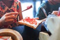 Hand ladle Strawberry jam making for breakfast. Royalty Free Stock Photo