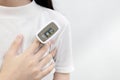 Hand of lady woman with an attached pulse oximeter on finger or fingertip for examination of the lung disease,diagnose of Royalty Free Stock Photo