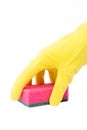 Hand in latex glove with scourer