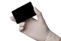 Hand in latex medical glove holding a credit card Royalty Free Stock Photo