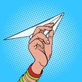 Hand launches paper airplane pop art vector