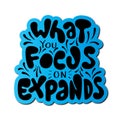 Hand Lettered What You Focus On Expands On White Background Royalty Free Stock Photo