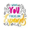 Hand Lettered What You Focus On Expands On White Background Royalty Free Stock Photo