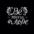 Hand lettering Be joyful in hope on black background