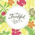 Hand lettering Be thankful on floral background.