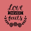 Hand lettering with bible verse Love never fails made with flowers on pink background Royalty Free Stock Photo