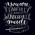 Hand lettering with bible verse You are fearfully and wonderfully made on black background.