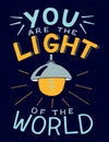 Hand lettering with bible verse You are the light of the world, made with glowing light bulb. Royalty Free Stock Photo