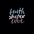 Hand lettering Faith, hope and love on black background.