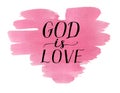 Hand lettering God is love on watercolor pink heart. Royalty Free Stock Photo