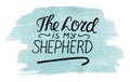 Hand lettering The Lord is my shepherd with stick on watercolor background.