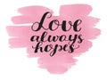 Hand lettering Love always hopes made on watercolor background. Royalty Free Stock Photo
