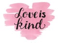Hand lettering Love is kind made on watercolor background. Royalty Free Stock Photo