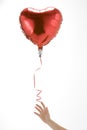 Hand Letting Go Of Heart Shaped Balloon Royalty Free Stock Photo